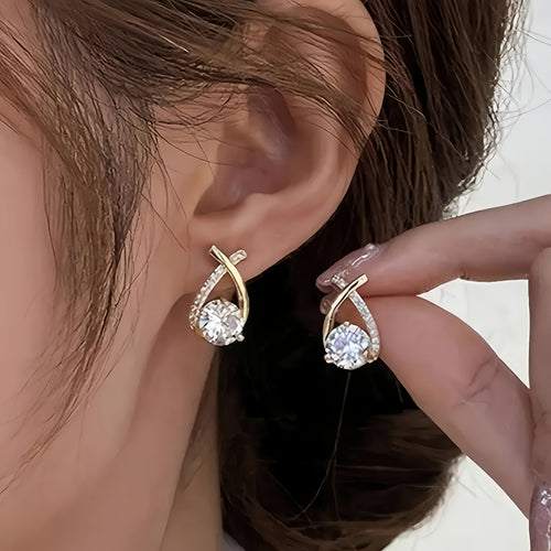 Boucles d'oreilles en forme de clou avec croix en or et zirconiums