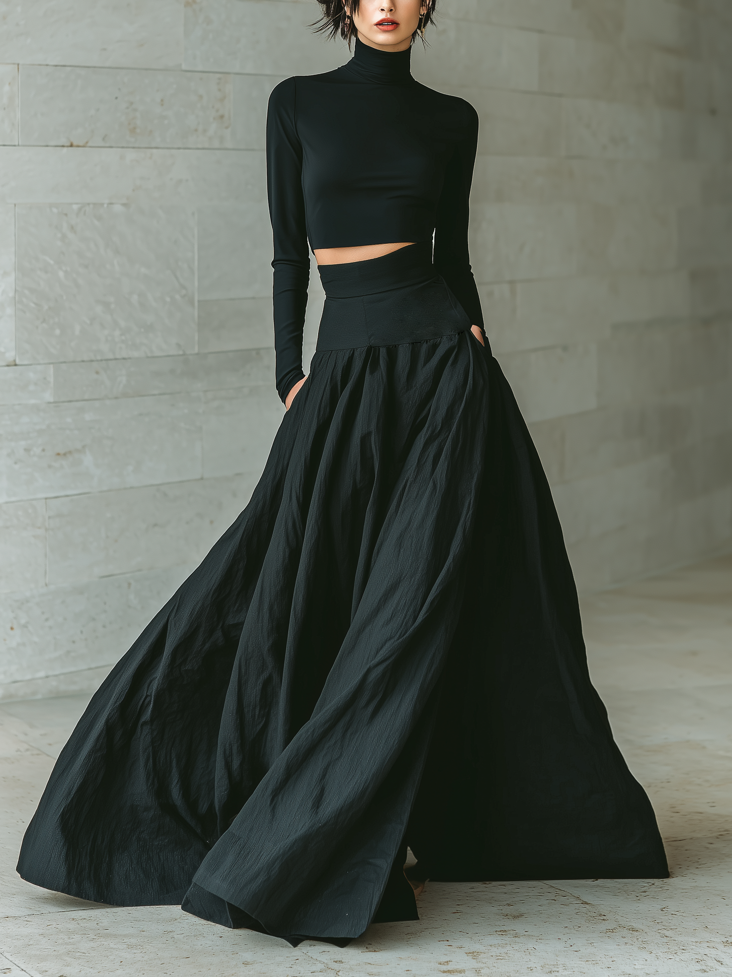 T-shirt femme élégant et tendance en noir avec col montant, manches longues, cropped, associé à une jupe longue noire MDA2692K3AN