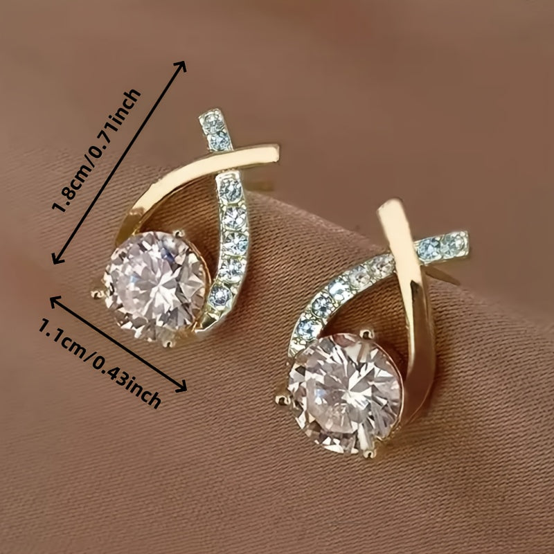Boucles d'oreilles en forme de clou avec croix en or et zirconiums