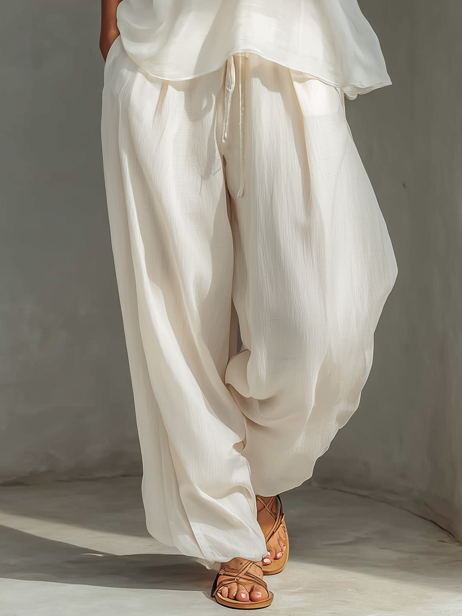 Ensemble deux pièces pour femmes en couleur crème avec un top sans manches en soie transparente et une jupe ample en tissu de coton et lin MDZ1039C4T