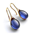 Boucles d'oreilles pendantes élégantes avec des cristaux
