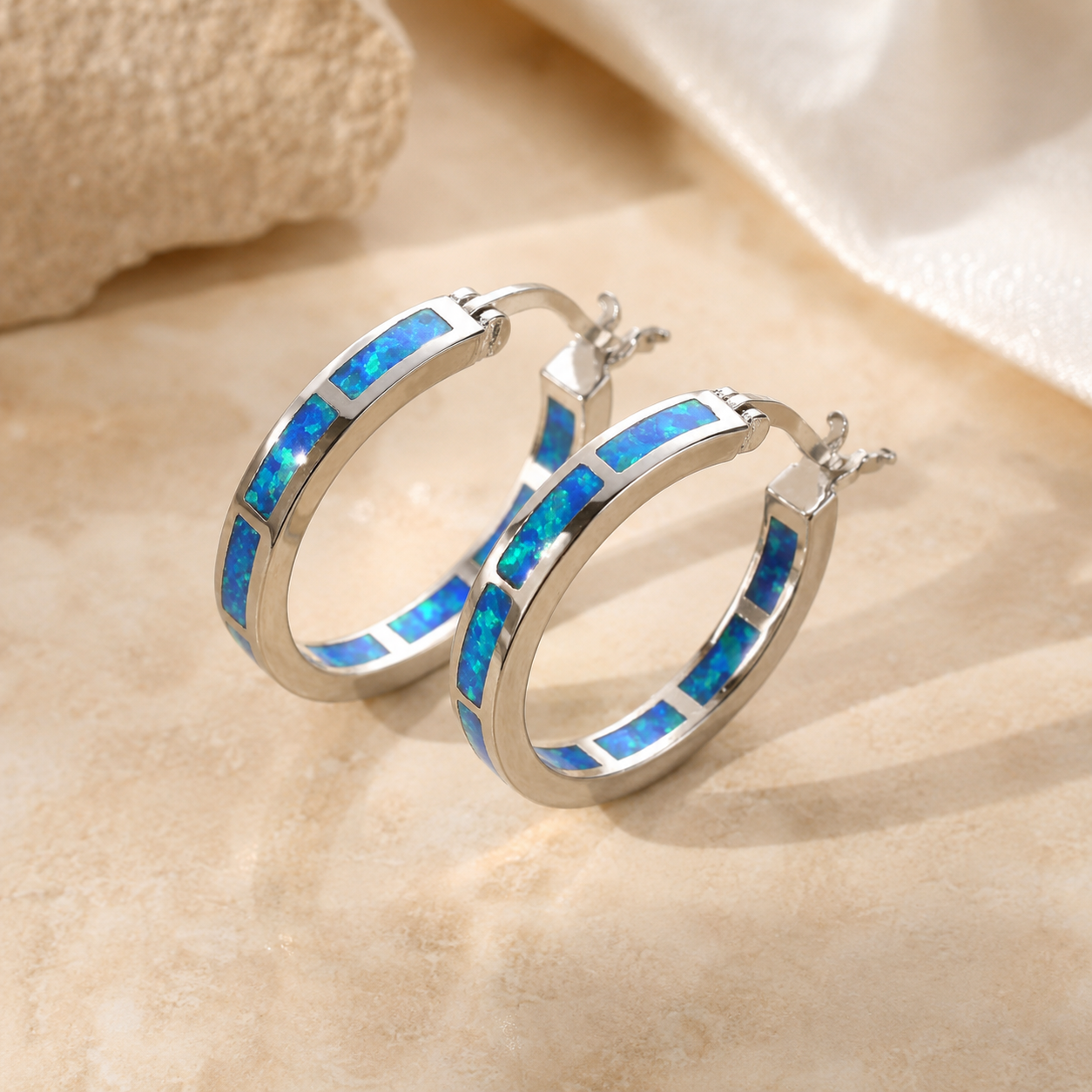Boucles d'oreilles en forme de cercle avec opale bleue