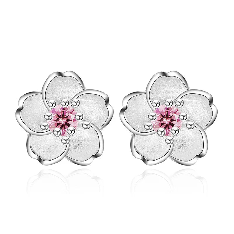 Boucles d'oreilles en forme de fleur avec des zirconiums