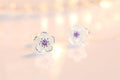 Boucles d'oreilles en forme de fleur avec des zirconiums