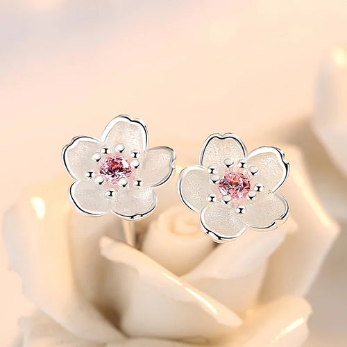 Boucles d'oreilles en forme de fleur avec des zirconiums