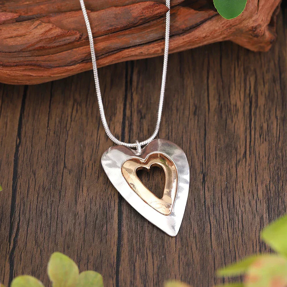 Collier vintage en forme de cœur en argent et or précieux