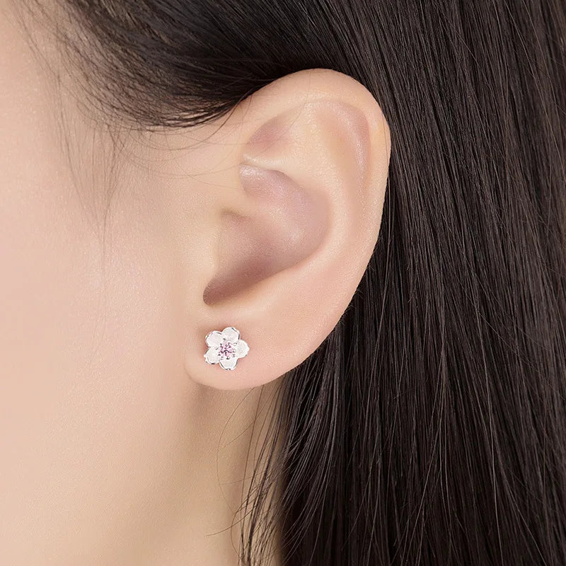 Boucles d'oreilles en forme de fleur avec des zirconiums
