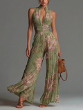 Robe à imprimé floral vert avec décolleté en V, sans manches, avec fermeture éclair et plis, jambe large