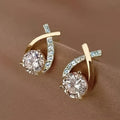 Boucles d'oreilles en forme de clou avec croix en or et zirconiums